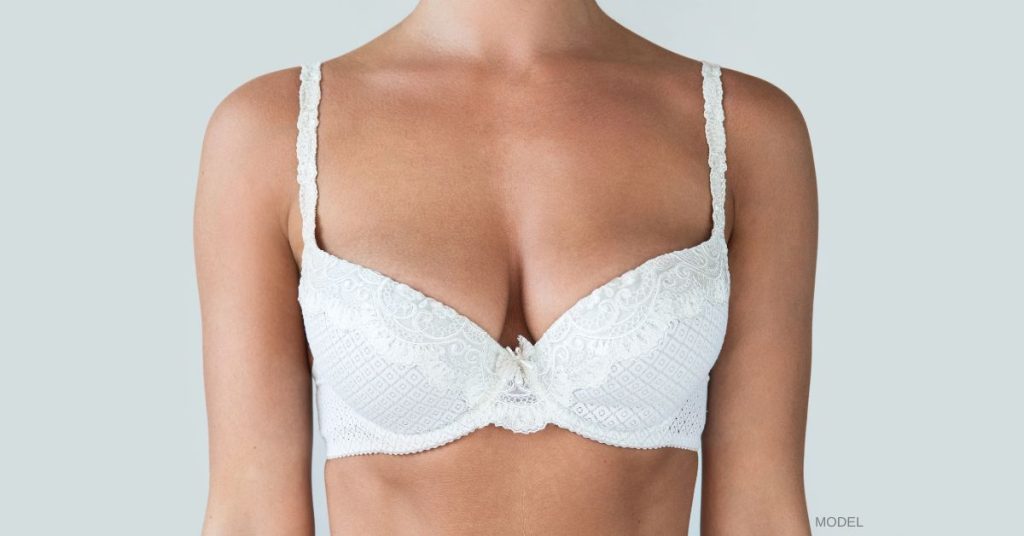 White women model that is wearing a white bra.